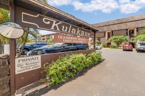 A sign for 'Kulakane' with a private guest area and oceanfront rental units available.