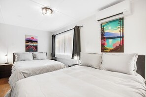 A hotel room with two beds, a window with curtains, and two paintings on the walls. - Wooded 4BR Mountainview Mount Walker Inn Dog Frie (Quilcene)