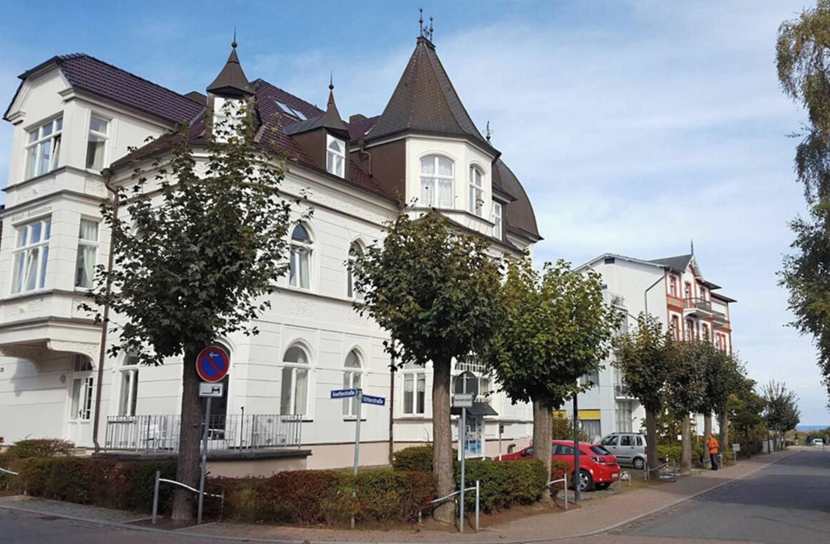 A historic building with a turret and a corner entrance.