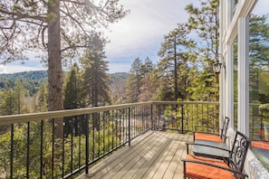 A balcony with a view of a forest and a mountain range. - The Best Lake View!! (Crestline)