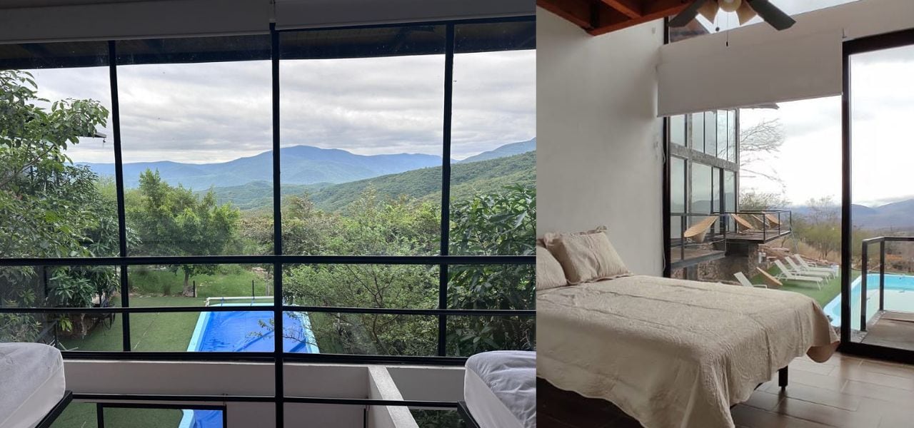 Une chambre dotée d’une grande fenêtre donnant sur un paysage montagneux.