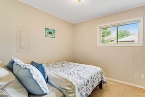 A bedroom with a bed, a window, and a door. - 2BR Oceanview Birch Bay Dog Friendly - Patio (Blaine)