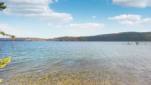 A clear lake with a dock and a bench, surrounded by hills and trees. - 3BR Oceanfront Dog Friendly | Fireplace (Port Townsend)