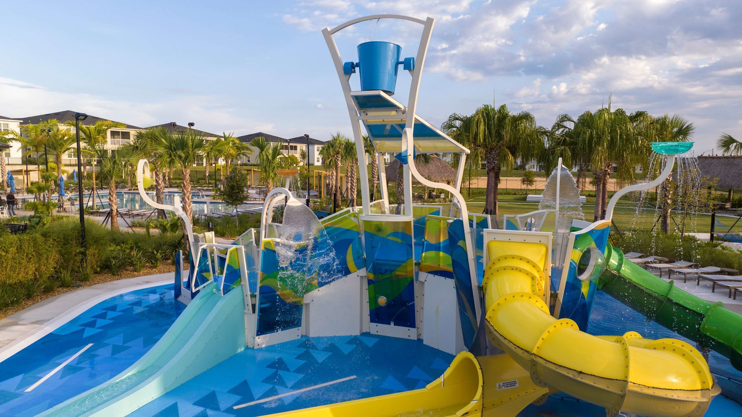 A water park with multiple slides and a pool area.