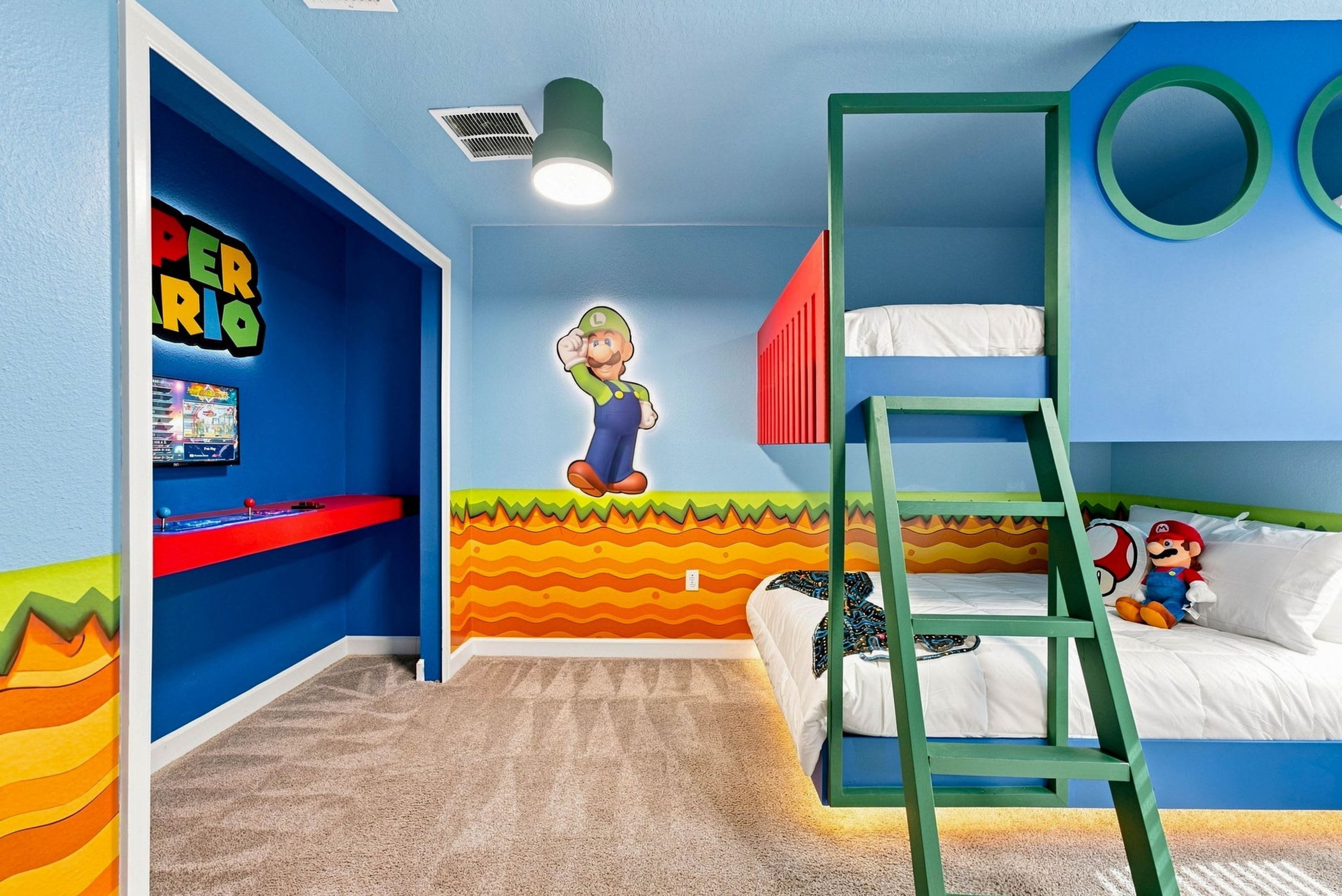 A child's bedroom with a bunk bed, a ladder, a Mario-themed wall, and a shelf with a game console.
