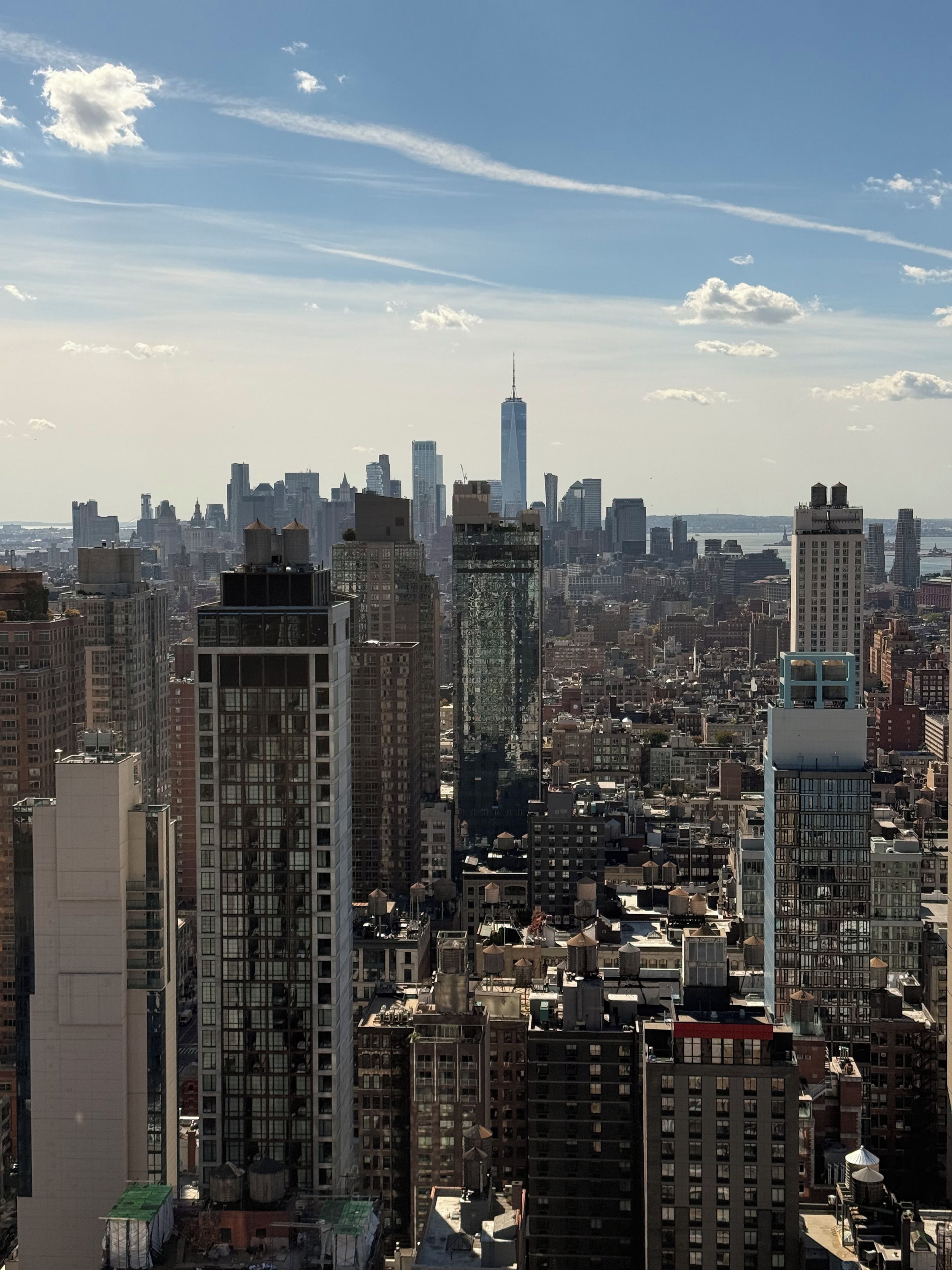 A cityscape with high-rise buildings and a clear sky.