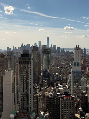 A cityscape with high-rise buildings and a clear sky.
