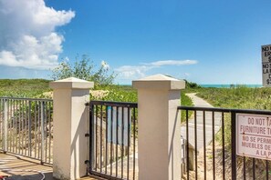 A gated entrance with a clear view of the beach and ocean. - Saida Towers I #402 - Oceanfront, Pools & Hot Tub (South Padre Island)