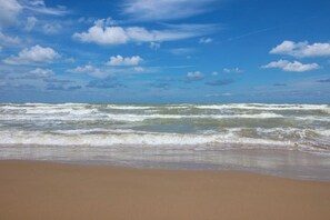 A beach with waves and a clear sky. - La Isla Condominiums #C105 (South Padre Island)