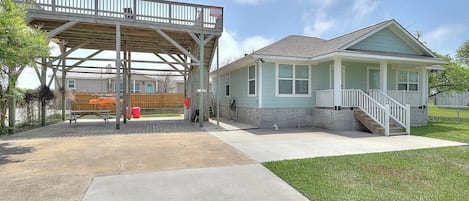 A single-story house with a covered patio area and a front porch.