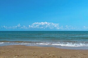 A beach with a clear sky and calm sea. - Casa de la Isla/Mars Island Unit A (South Padre Island)