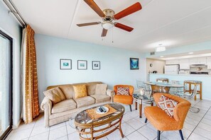 A living room with a sofa, armchairs, a coffee table, and a ceiling fan. - Continental #201 - Gulf-Front with Beach Access (South Padre Island)