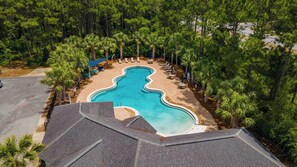 A swimming pool surrounded by palm trees and a paved deck with lounge chairs. - Pet-Friendly Lake Views from Most Rooms, Townhome, Walk to Beach & (Panama City)