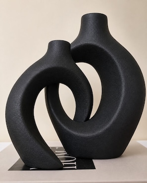 A sculpture with abstract shapes and a metallic element.