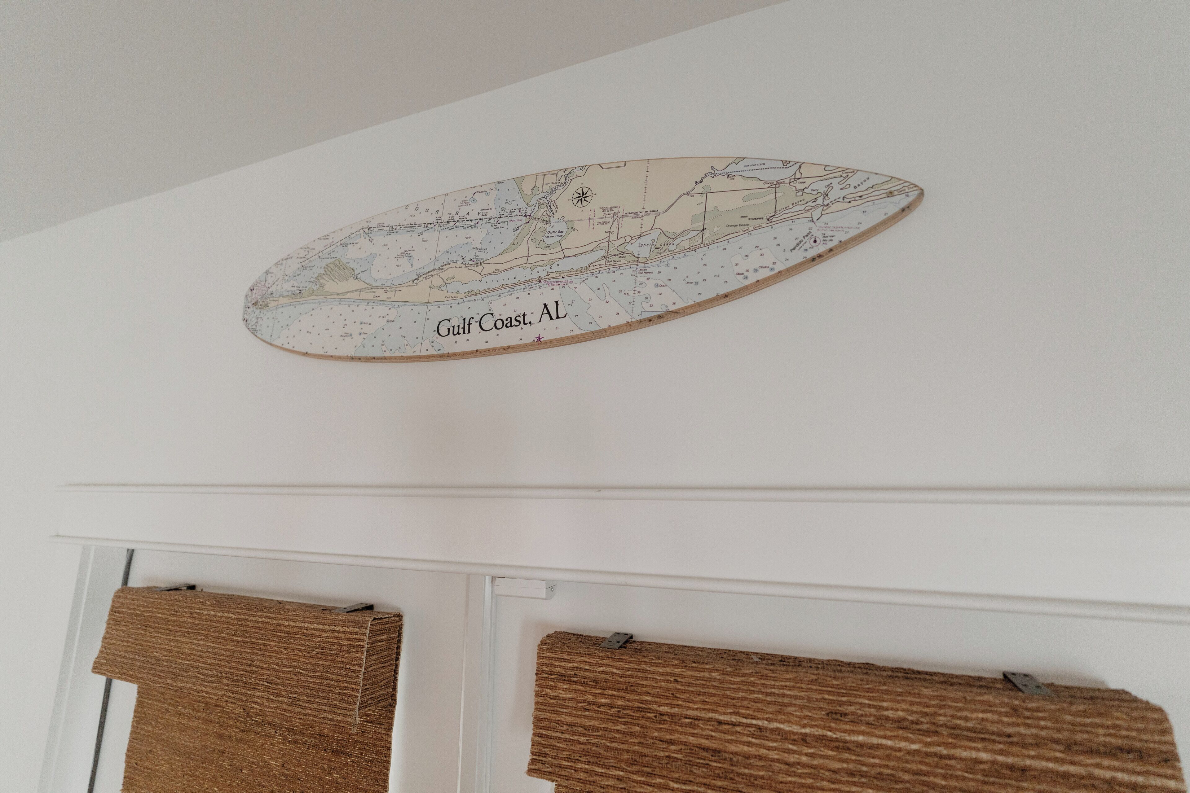 A wall-mounted map of Gulf Coast, AL.