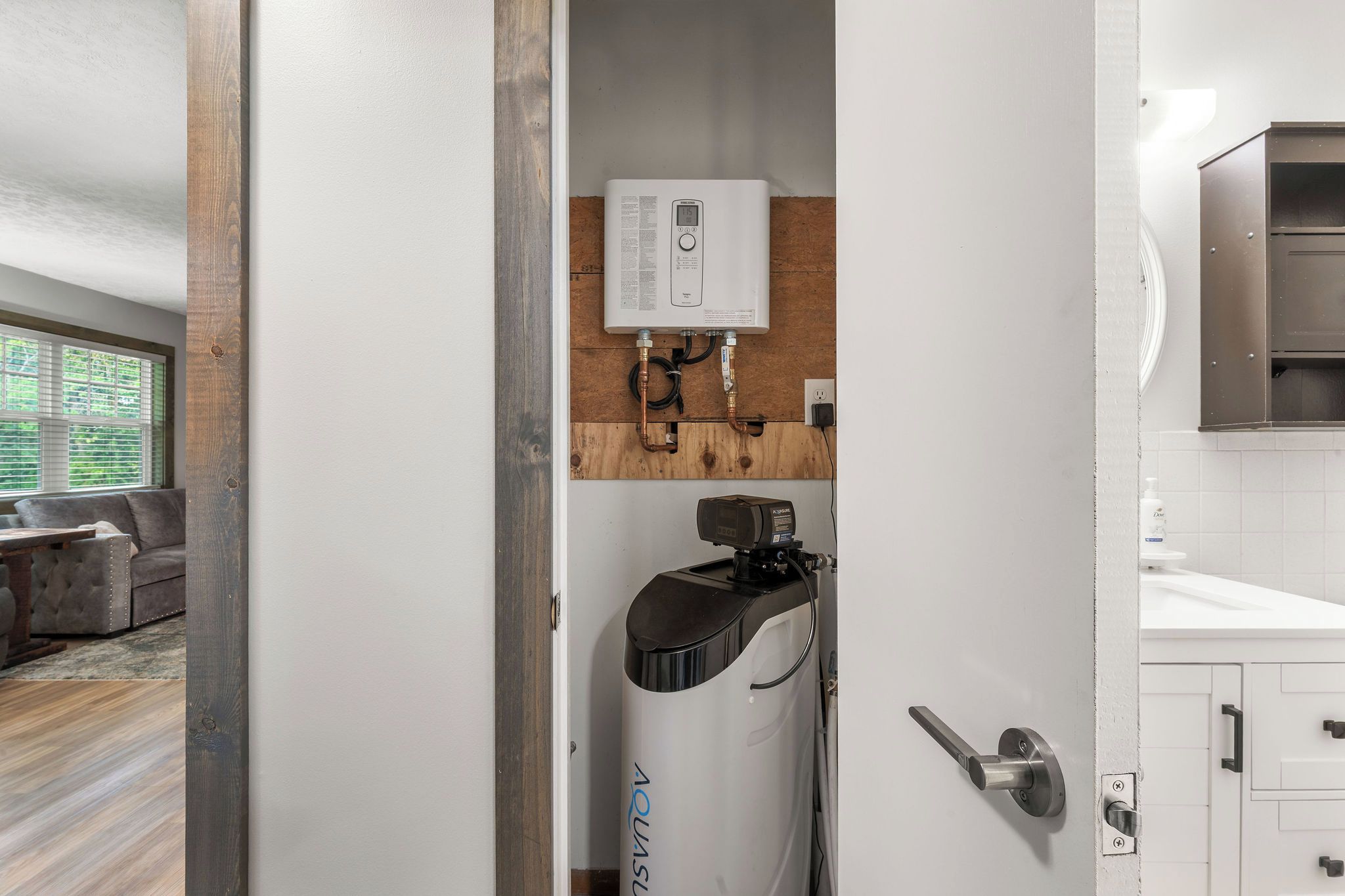 A modern bathroom with a shower, toilet, and sink.