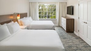 A hotel room with two beds, a TV, a window with curtains, and a dresser. - 2BR Villa at Marriott's Lakeshore Reserve Near Disney & Orlando Attractions (Orlando)