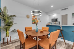 A modern kitchen with white cabinets, a microwave, and a sink. - Indian Wells Condo, Steps to Pool,  Minutes to La Quinta El Paseo and Coachella (Indian Wells)