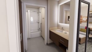 A modern bathroom with a bathtub, a sink, and a mirror. - Accessible 1BR Suite | Free Daily Breakfast + Pool (Denton)