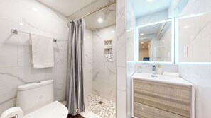 A modern bathroom with a shower, toilet, and sink. - Luxury Spa Escape with Pool & Jacuzzi [Near Rogers Stadium] (Toronto)