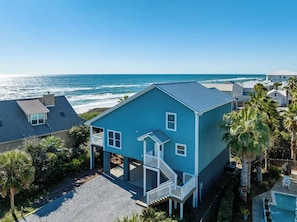 A coastal house with a balcony, a pool, and a view of the ocean. - Pet Friendly with Gulf Views- 50 Sea Turtle by Royal Destinations (Santa Rosa Beach)