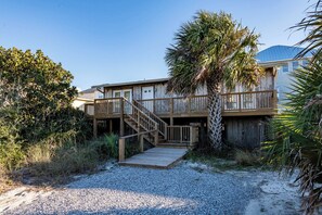 A wooden building with a deck and stairs leading to a door marked with the number 5231. - Gulf Front with Oyster Lake Views- High Dune by Royal Destinations (Santa Rosa Beach)