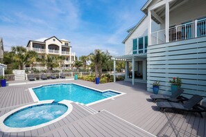 A pool area with a hot tub, lounge chairs, and a wooden deck. - Gulf Views, Steps From Beach Access- Jada's Dare by Royal Destinations (Santa Rosa Beach)