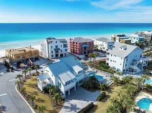 A coastal resort with multiple buildings, a swimming pool, and a view of the ocean. - Gulf Views, Steps From Beach Access- Jada's Dare by Royal Destinations (Santa Rosa Beach)