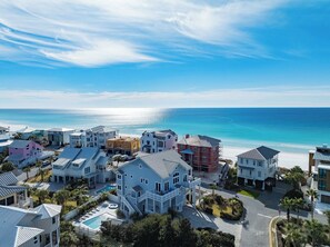 A coastal residential area with houses, a swimming pool, and a beach. - Gulf Views, Steps From Beach, Elevator- Mimosa Mornings by Royal Destinations (Santa Rosa Beach)