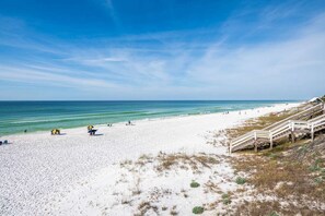 A beach with a wooden staircase leading down to the shore, a sandy beach, and the ocean. - Private Pool, Steps From Beach Access- Ocho Cinco by Royal Destinations (Santa Rosa Beach)