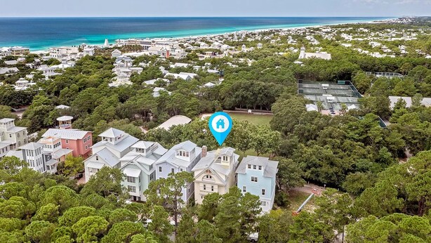 A coastal residential area with houses, a lighthouse, and a beach. - Seaside Home w/ Rooftop Gulf Views- Off the Bucket List by Royal Destinations (Santa Rosa Beach)