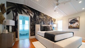 A bedroom with a bed, a nightstand, a wall mural, a ceiling fan, and a window. - Seaside Home w/ Rooftop Gulf Views- Off the Bucket List by Royal Destinations (Santa Rosa Beach)