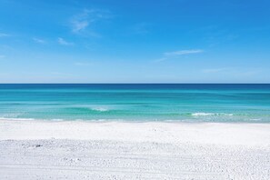 A beach with clear turquoise water and white sand. - Gulf Front w/ Private Beach Access- Sea Turtle Cottage by Royal Destinations (Santa Rosa Beach)