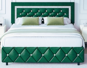 A bed with a tufted headboard, green upholstered bed frame, and white bedding. - Stylish 4BR North Port St. Lucie Retreat  Sleeps 8 Large Backyard (Port St. Lucie)