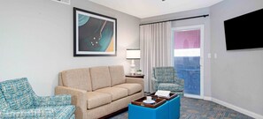 A hotel room with a sofa, armchair, and a coffee table. - Spencer St. Resort - Spacious  2BDR - SLEEPS 6 - Full Kitchen – Jan. 3–10, 2027 (Las Vegas)