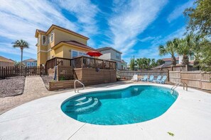 A residential property with a swimming pool, a wooden deck, and a fenced backyard. - Tuscan Sun 4769-Private Pool-Sleeps 10 (Destin)