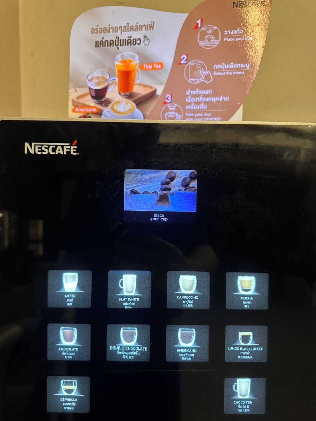 A Nescafé coffee machine with a digital display and multiple coffee options.