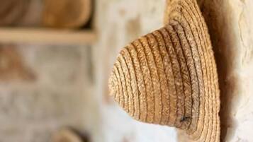 A textured wall with a hanging object.