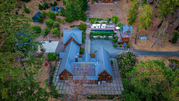 A cluster of cabins with a central pool, surrounded by dense forest. - The Ridge at Mill Creek- Hot Tub, Pool & Tastings (Healdsburg)
