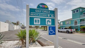 A beach access sign for Gulf Circle Beach with symbols for restrooms and wheelchair access. - #9 | Beach Escape Studio w/Pool | Walk Everywhere (South Padre Island)