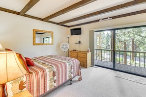 A bedroom with a bed, a dresser, a mirror, a fan, and a television. - 3-bedroom condo in fabulous Kings Beach close to Beach and Ski Resorts. (Kings Beach)