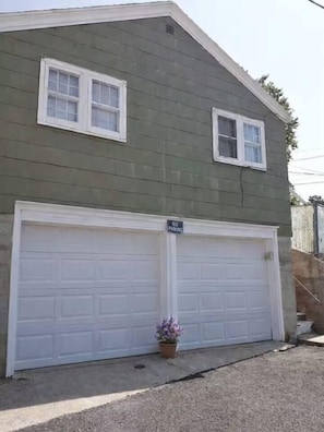 The property has a two-car garage located underneath the cottage. Suitable only for motorcycles and smaller vehicles. - The Nest - Main House (Lead)
