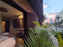 A modern interior with a sofa, a small table, and a wall-mounted artwork.