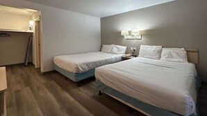 A hotel room with two beds, a desk, and a wardrobe. - Enjoy a Convenient Kitchen-Equipped Stay for Longer Comfort | Free Parking (Lubbock)