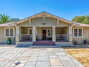 A single-story house with a front porch, a small front yard, and a clear sky. - Gated Glen Ellen wine country 3 bed/2 bath house with Sonoma Mountain views (Glen Ellen)