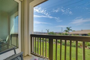 A balcony with a view of a residential area, including houses and power lines. - Townhome w/ Several New Haven Community Perks! (Ontario)