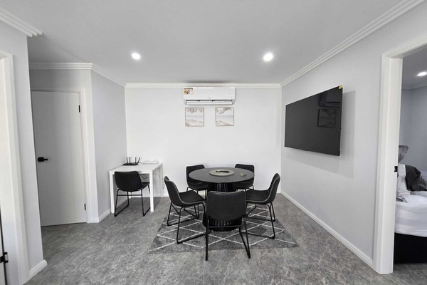 Dining Area : The dining area brings together meals, screen time and a small workspace in one tidy, open section of the home.