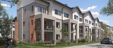A modern multi-story residential building with balconies, a paved driveway, and a car parked in front.