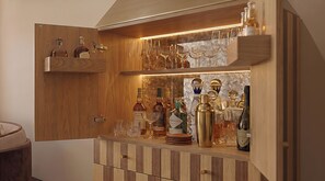 A wooden bar area with shelves holding bottles and glasses. - O'Two Hotels - Mar (Cape Town)