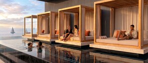 A luxurious poolside area with private cabanas, a clear view of the sea, and a glass infinity pool. - O'Two Hotels - Mar (Cape Town)